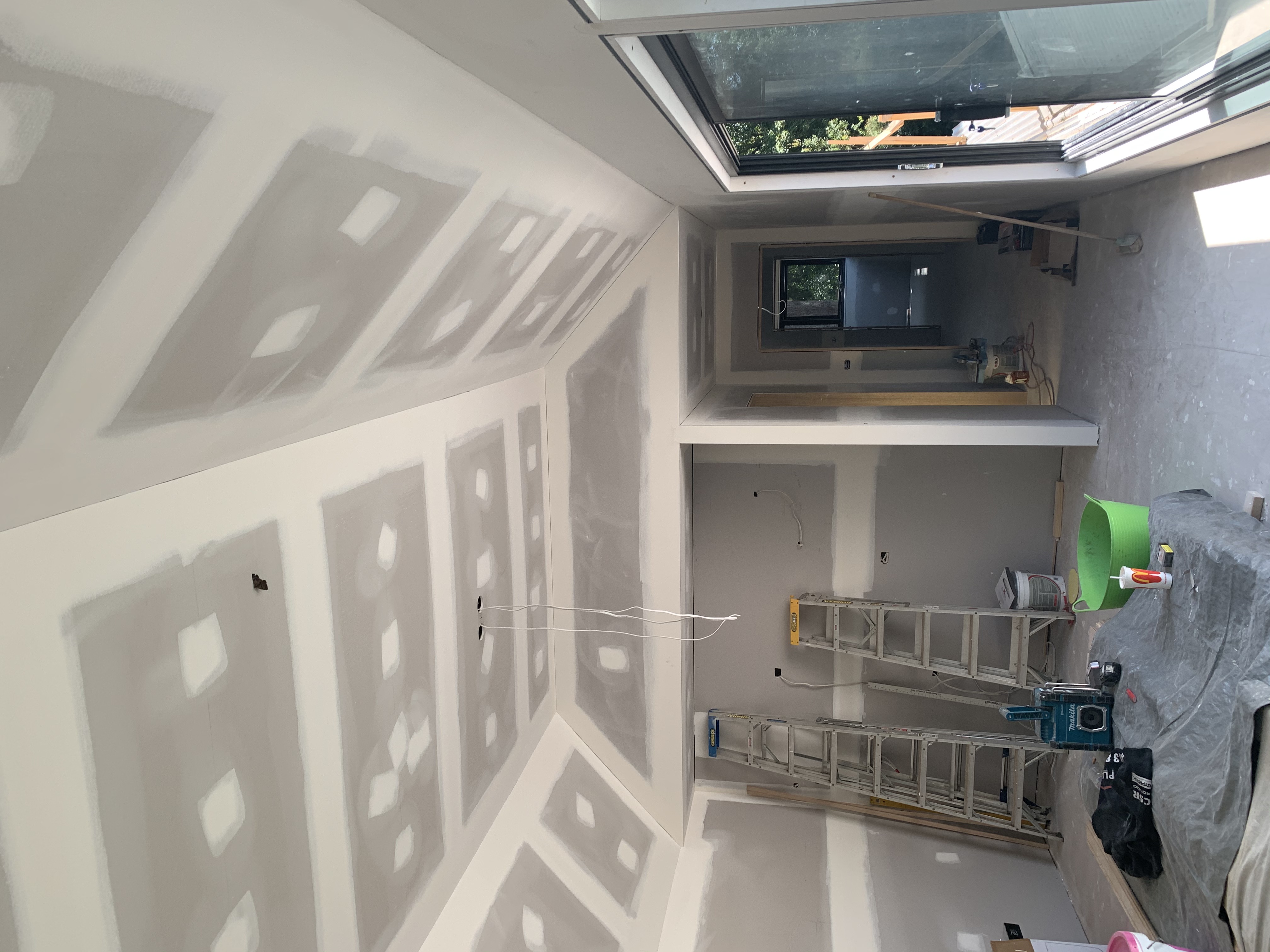 Interior plasterboard work with ceiling and walls prepared